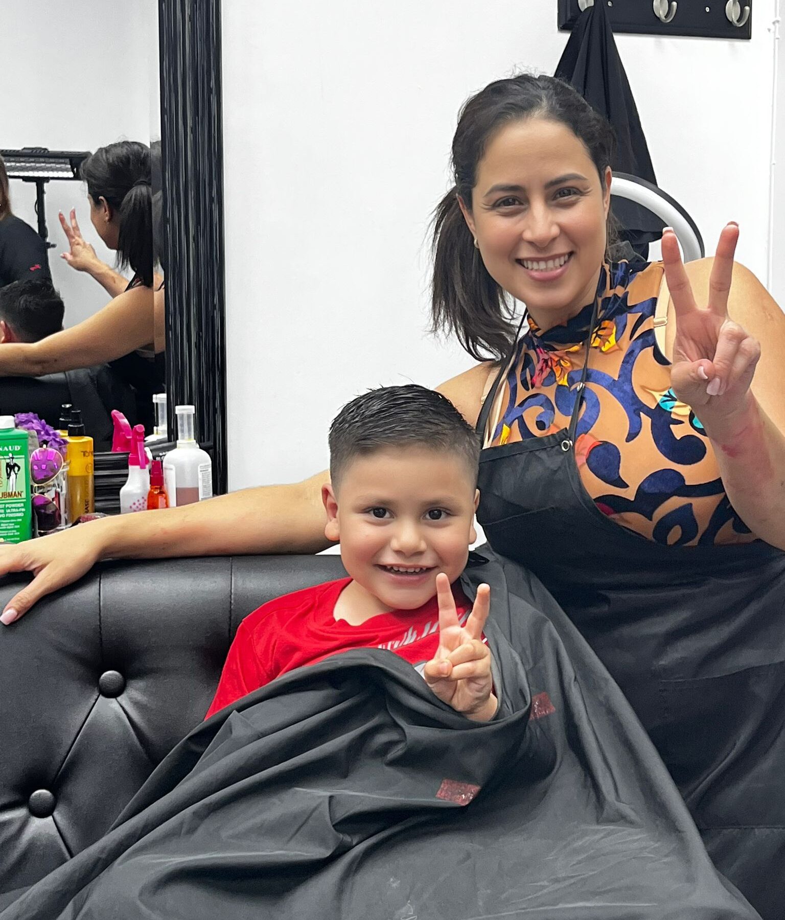 Hair Fashion by Dailen client and stylist smiling after a haircut